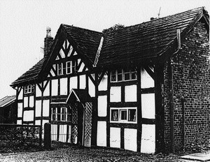 1967 photograph shows stone-slate roof and cobbled street